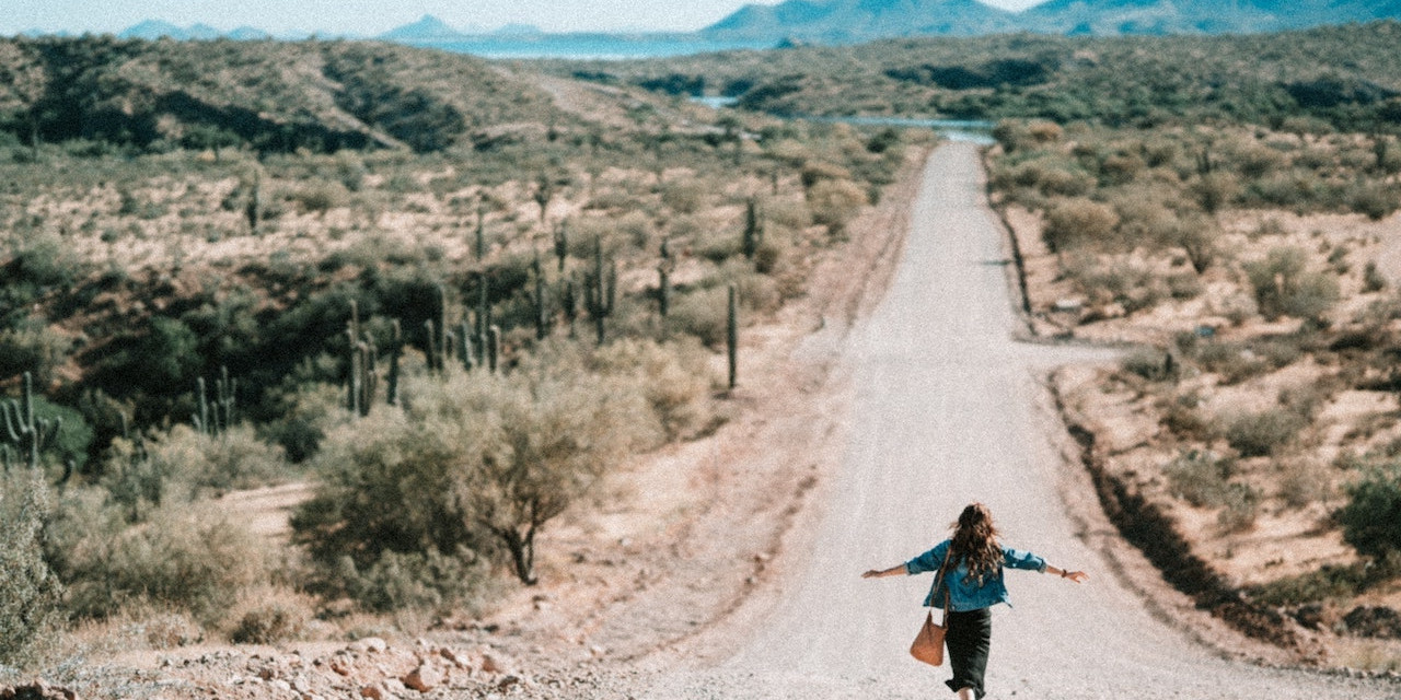 Person running on empty road